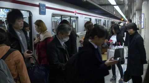 Boarding A Busy Train Inside The Tokyo Metro In Tokyo, Japan Stock Footage 159056729