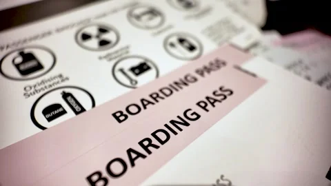 Boarding pass over prohibited items list informing passengers about dangerous Stock Footage 313937148