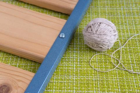 Boards and threads on a green background. Stock Photos