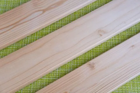 Boards on a green background. Stock Photos