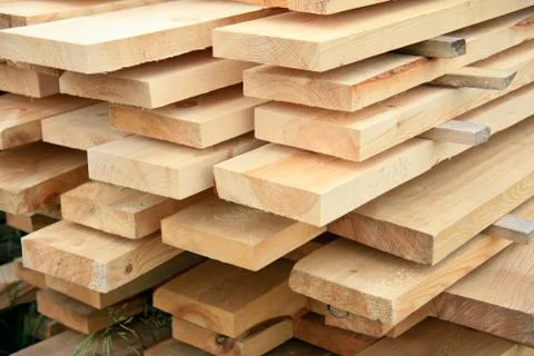 Boards in stacks outside Stock Photos