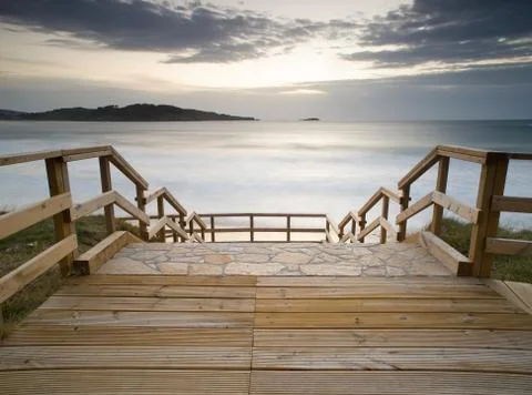 Boardwalk in the beach Stock Photos