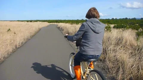 Boardwalk Bicyclist Stock Footage