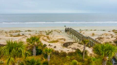Boardwalk to empty beach Stock Photos