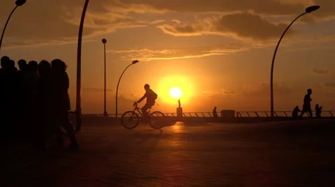 Boardwalk silhouette sunset Stock Footage