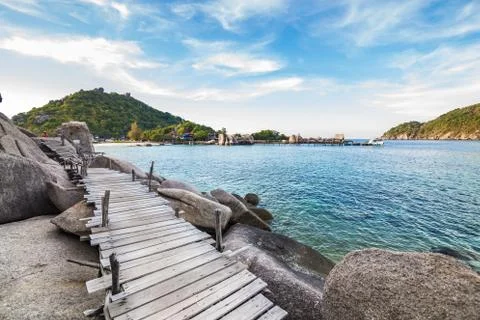 Boardwalk on the split rock to the beach Stock Photos