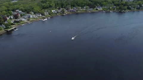 Boat from above on river panning down Stock Footage 156002897