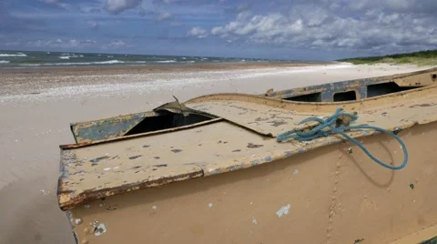 Boat aground on a sandy beach Stock Footage 67236602
