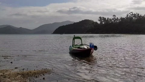 A boat anchored at a beach 库存影片 143443695