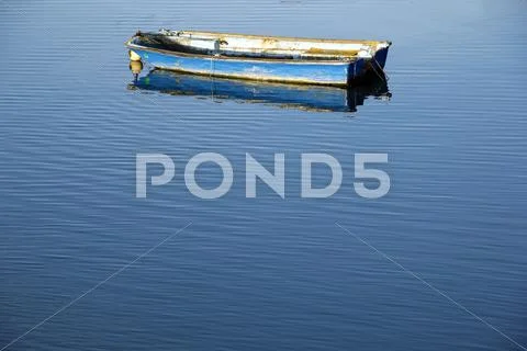 Boat and calm blue sea Stock Photos