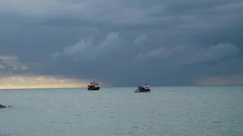 Boat and float on calm sea under nasty evening sky Stock Footage 344716229