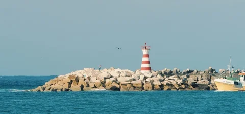 A boat and a lighthouse  Stock Footage 123254000