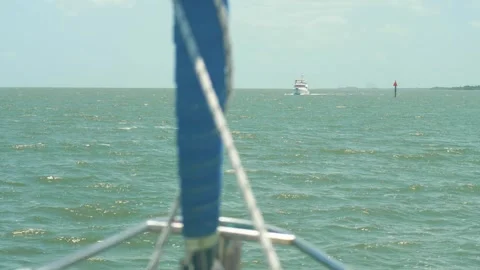 Boat approaching on Florida ICW from the bow of Sailboat - Medium distance Stock-Footage 281725337