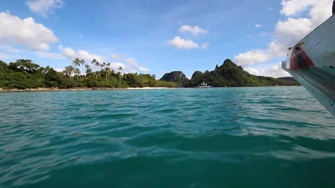 Boat approaching an island Stock Footage 248821598