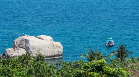 Boat are dancing with the ocean waves and people on a cliff - timelapse Stock Footage 50672827