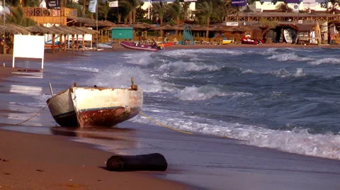 Boat ashore in a storm Stock Footage 1101804