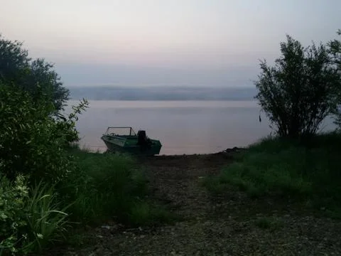 Boat on the background of the lake Stock Photos