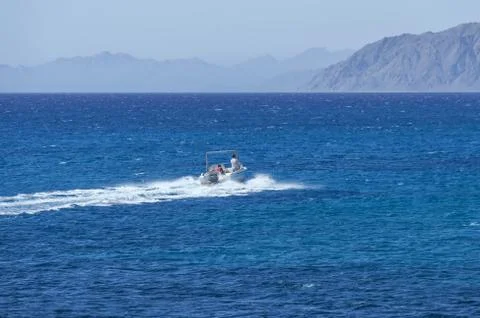 Boat, in the background of the mountains Stock Photos