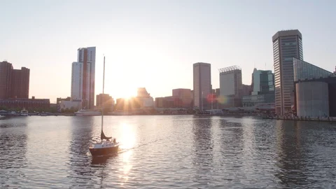 Boat on Baltimore Inner Harbor at Sunset, Drone Stock Footage 99060816