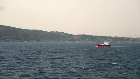 Boat Battling Rough Seas in the Strait of Messina, Sicily Stock Footage 329477143