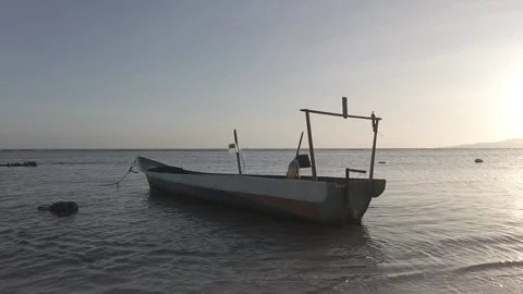 Boat on the beach at dusk Stock Footage 210472652