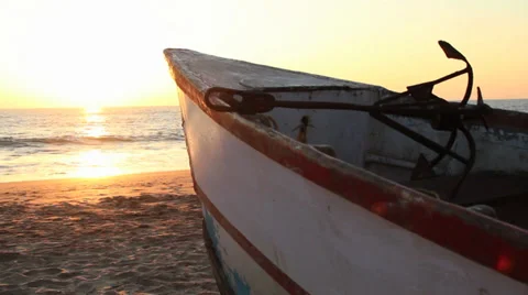 Boat on the beach at sunset Stock Footage 37345964