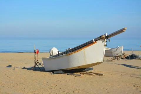 Boat on the beach in winter Stock Photos