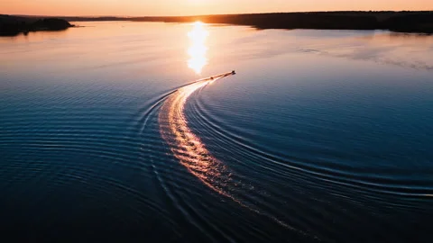 Boat on beautiful river at sunset. Video stock 135394766