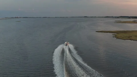 Boat From Behind in the Bay at Sunset Stock Footage 136025550