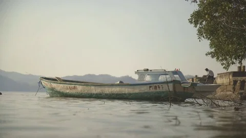 Boat being moored at the seaside Stock Footage 79791887