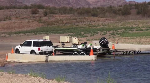 Boat being put back in the lake after cleaning Stock Footage 41648146