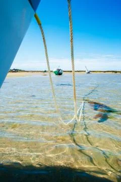 Boat between anchor line Stock Photos