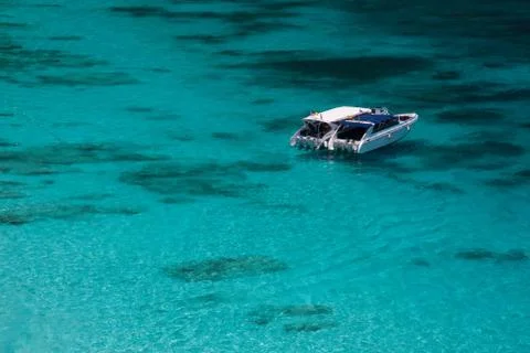 Boat on blue Stock Photos
