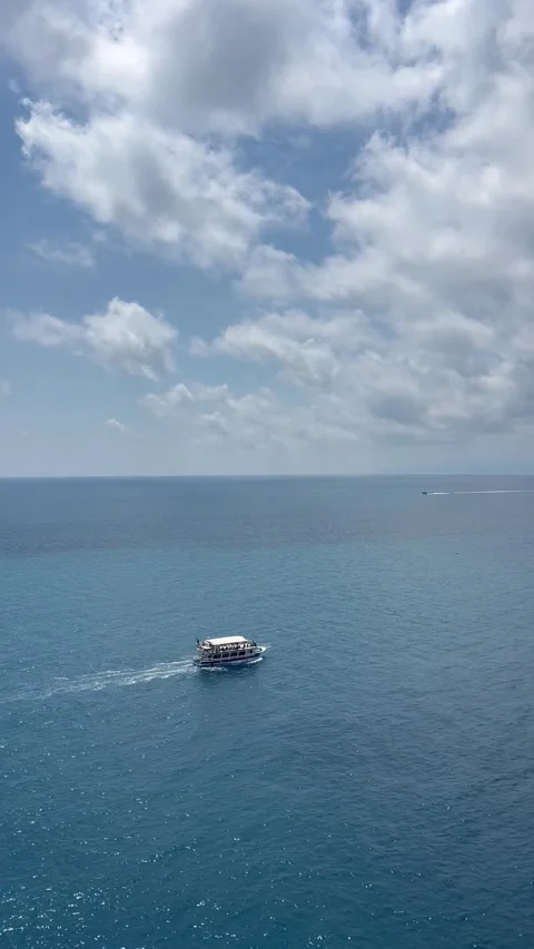 Boat in blue sea by summer Stock Footage 334445528