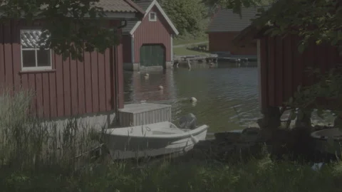 Boat by a boathouse Stock Footage 342341104