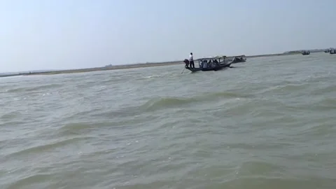A boat with a boatman running through a river Stock Footage 196980906