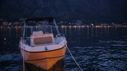 The boat bobs on the waves off the coast of the Boka Bay of Kotor. Evening Kotor Stock Footage 119061877
