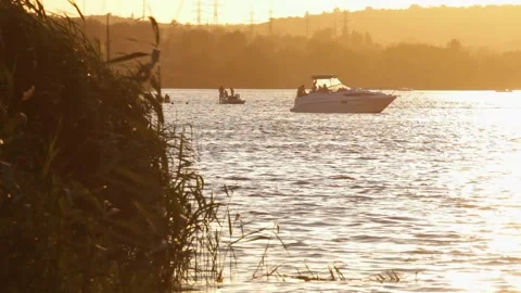 The boat bobs on the waves at sunset Stock Footage 135101702