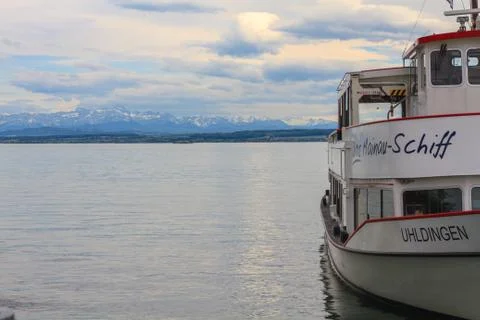 Boat on the bodensee with alps in the back Stock Photos