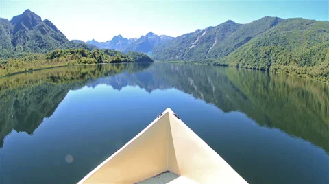 Boat bow and landscape of Ceasar Lake in Parque Nacional Corcovado during a fly Stock-Footage 34456278