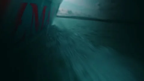 Boat Bow Cutting Through Dark Ocean at Night Stock Footage 232605512