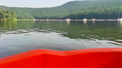 Boat bow view of Chandil dam reservoir framed by the lush Dalma Hills Stock Footage 327013816