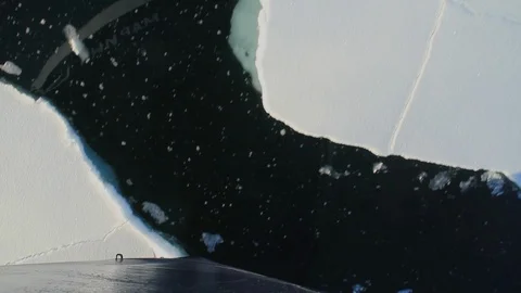 Boat breaking floating ice in Antarctica 4 Stock Footage 88284672