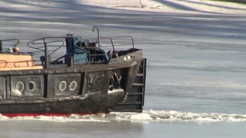 Boat breaks the ice on the River in the spring on a sunny day. Stock Footage 150122818