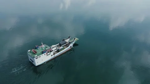 The boat on the calm lake and the reflection of the clouds on the water Stock Footage 213929625