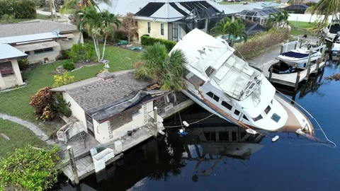Boat capsized and sinking in aftermath of Hurricane Ian in America Stock Footage 218675012