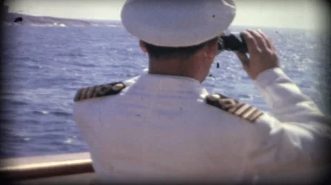 Boat captain looking through binoculars over the sea in Finland Stock Footage 53316881