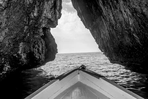 A boat in the a cave Stock Photos