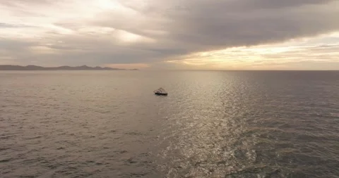Boat cloudy sunrise Stock Footage 240682820