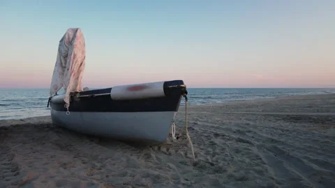 Boat on the coast at sunset Stock Footage 237333336